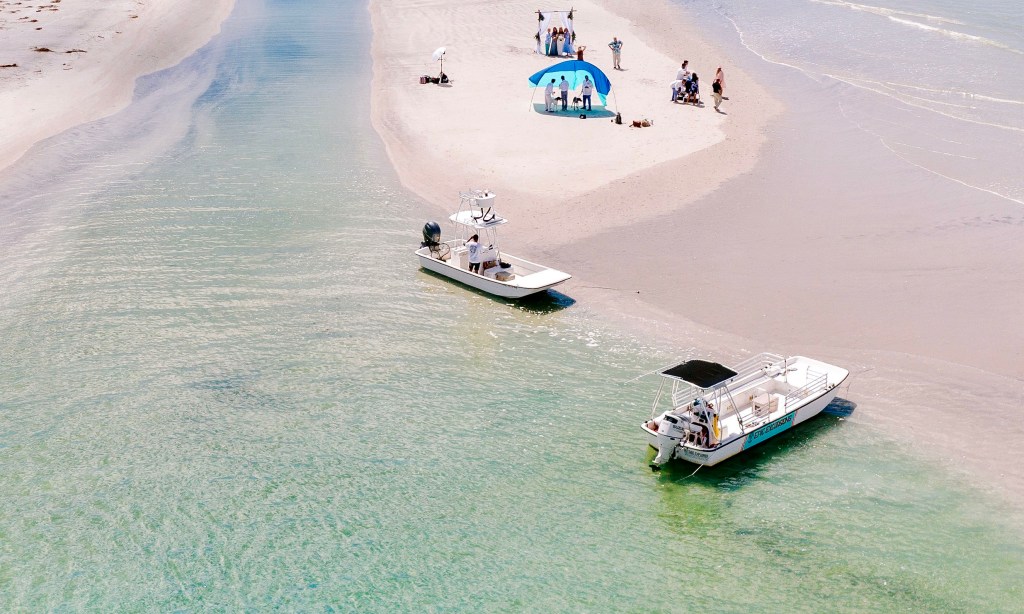 People enjoying the sandbar at Mason's Inlet 