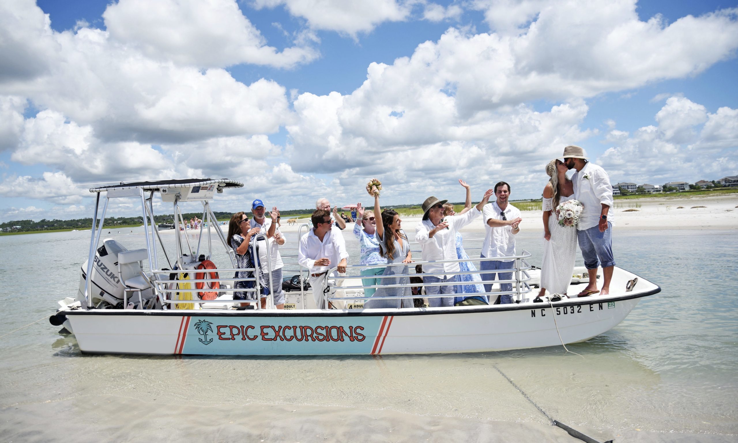 a group of people on a boat in the water