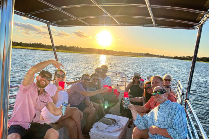 friends enjoying a sunset cruise in wrightsville beach