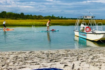 boat charter with paddle boarding