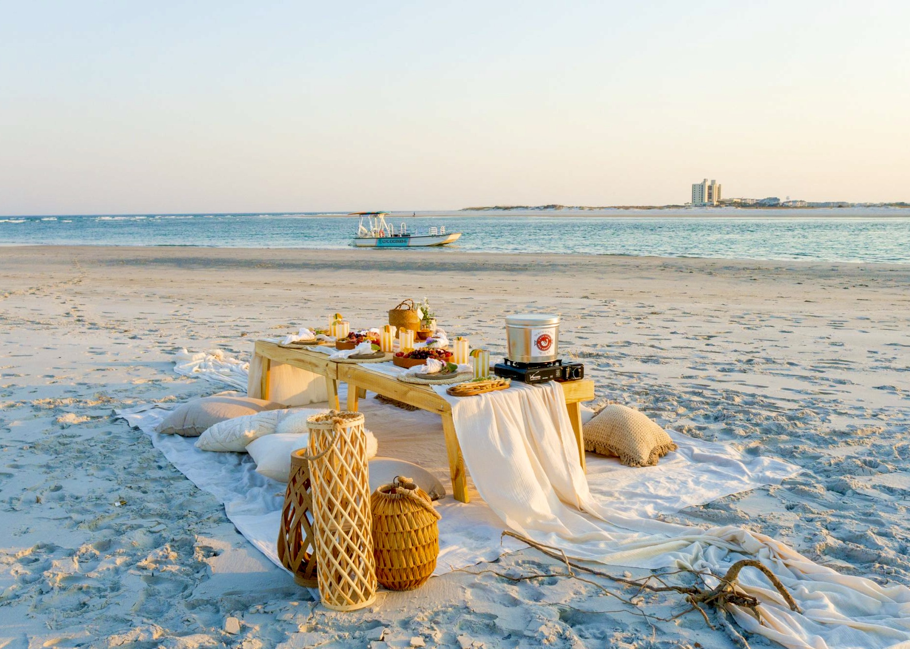 a boat sitting on top of a sandy beach